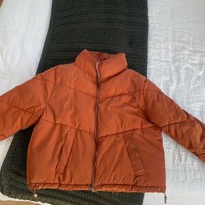 Orange puffer jacket